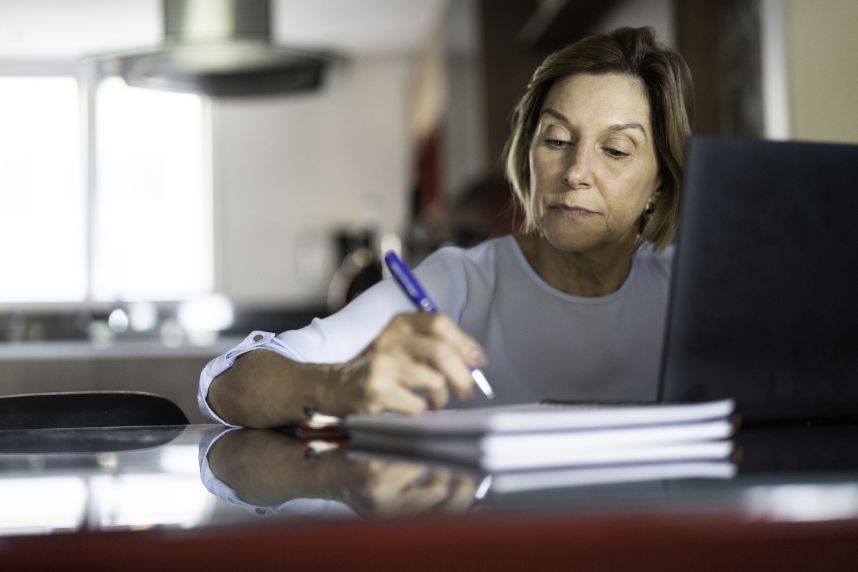 Mature woman doing home office work